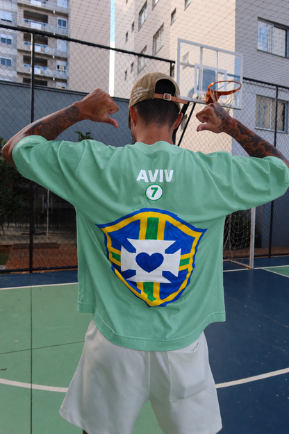 TEE BOXY 'DEUS É BRASILEIRO' - VERDE ESTONADO