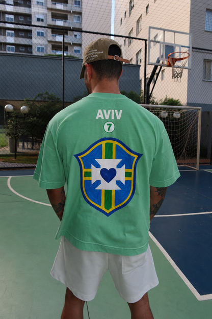 TEE BOXY 'DEUS É BRASILEIRO' - VERDE ESTONADO
